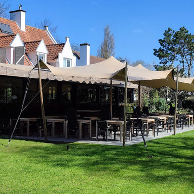 Flex Stretch Tent Q3 by Canvas Camp Luxury Outdoor Canopy table seating outdoor restaurant sunny day