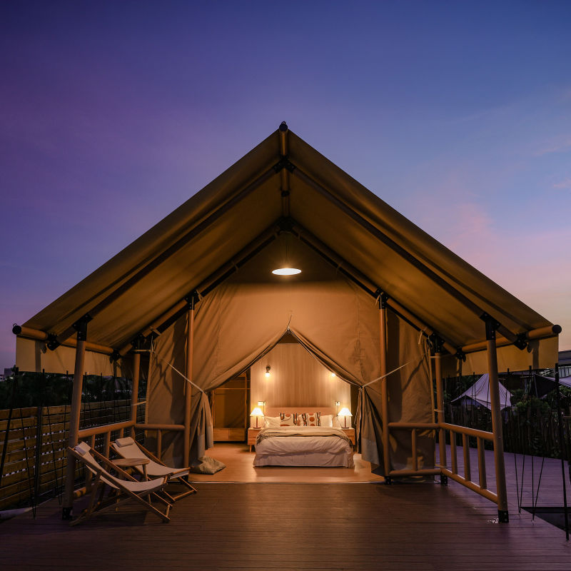 Safari Tent Solstice I by Luna Glamping front view at night