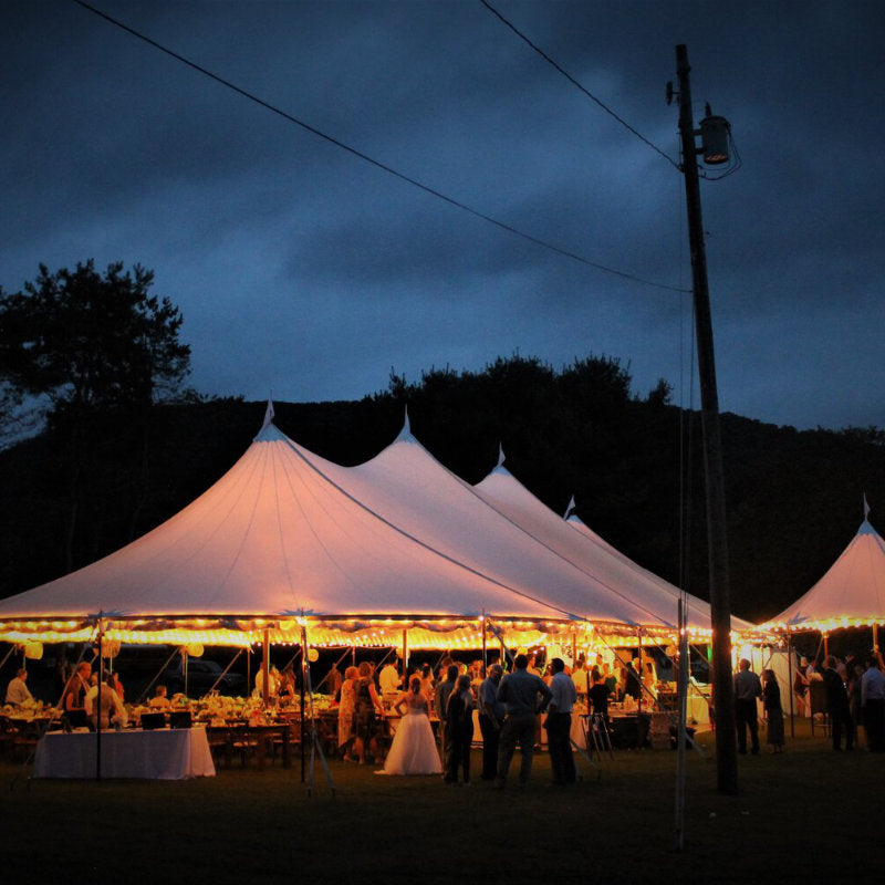 Sailcloth Event Tent by Canvas Camp Luxury Outdoor Canopy at night with lights