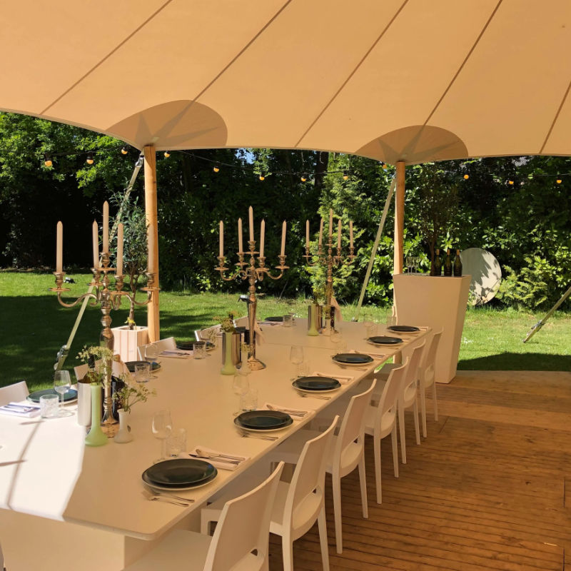 Sailcloth Event Tent by Canvas Camp Luxury Outdoor Canopy with long white table and chiars