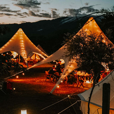 Starshade Event Tent by CanvasCamp  Luxury Outdoor Canopy with lights at night two canopies