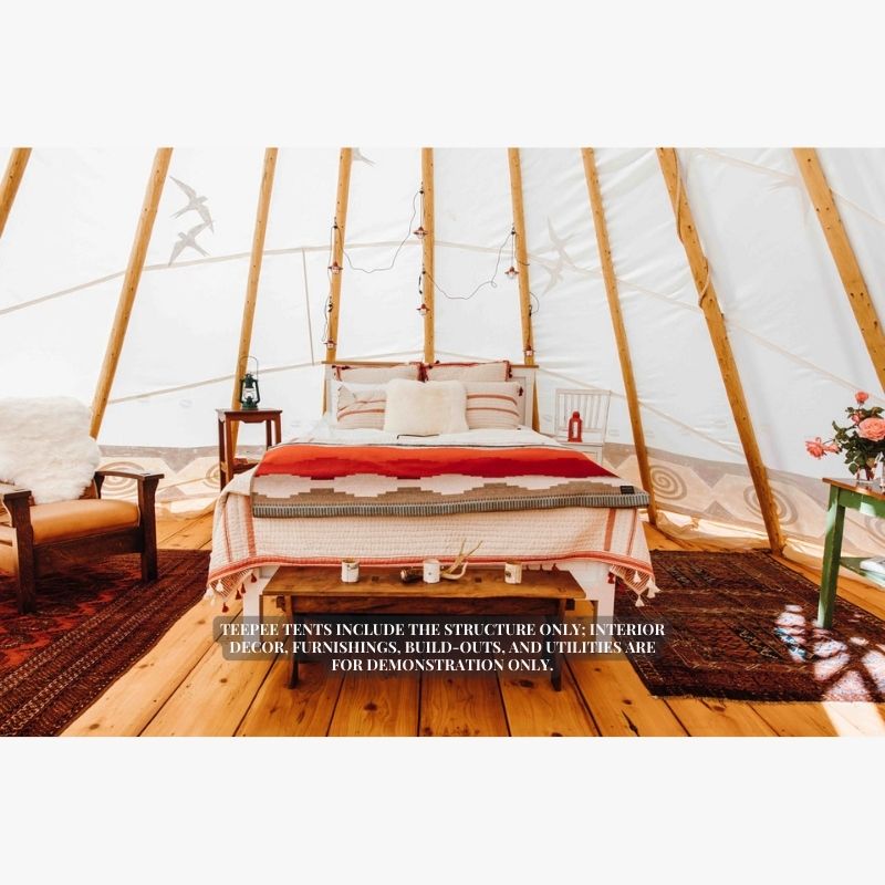 Teepee Tent by Nomadic Tipi Boho style interior view with bed chair and wood flooring
