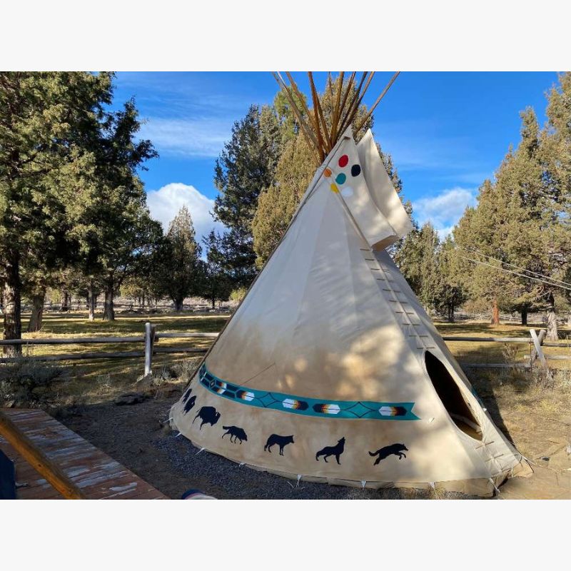 Teepee Tent by Nomadic Tipi Makers Native Artist Creations design on gravel at campground