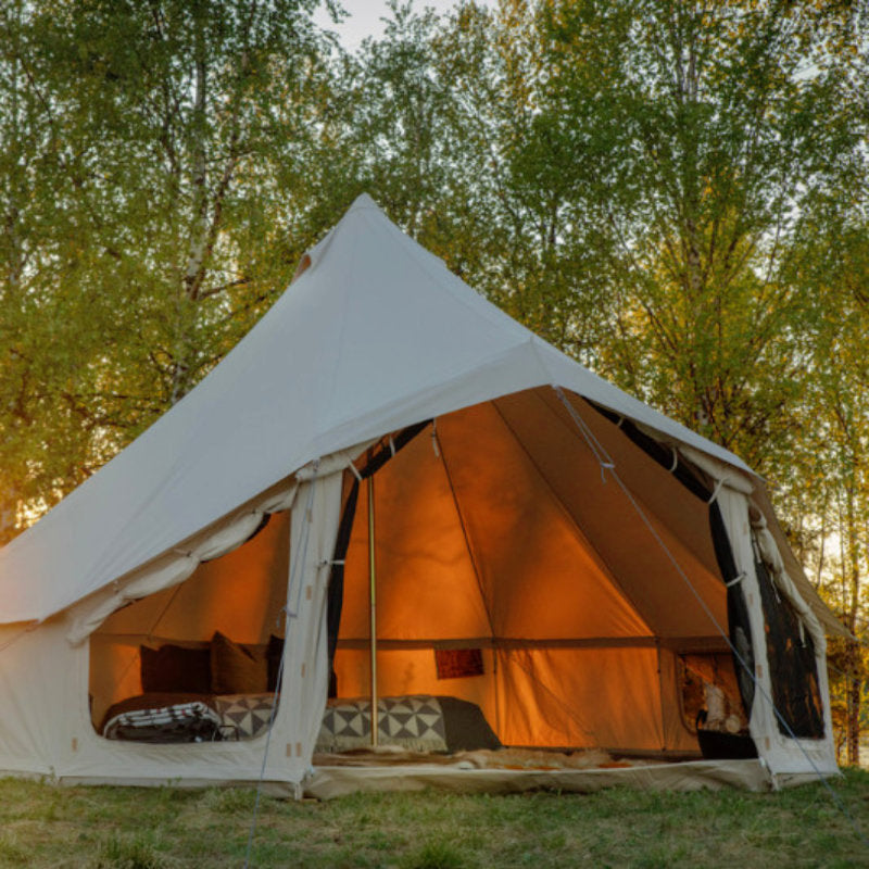Yurt Tent Sibley Apex by Canvas Camp on grass near trees