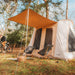 A Frame Tent Big Horn by Canvas Camp front left view outside on grass near trees doors closed