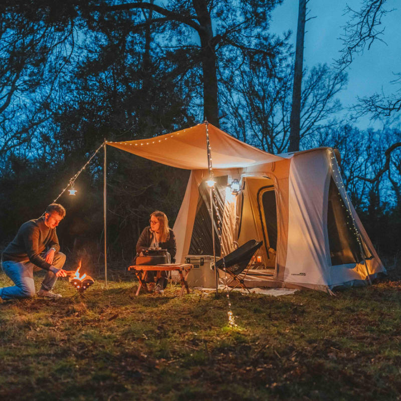 A Frame Tent Big Horn by Canvas Camp man and woman couple with campfire