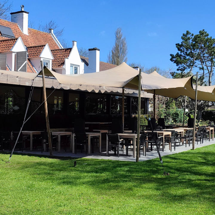 Flex Stretch Tent Q3 by Canvas Camp Luxury Outdoor Canopy table seating outdoor restaurant sunny day