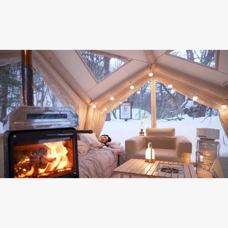 RBM Koala Hub beige interior with woman on bed and fireplace