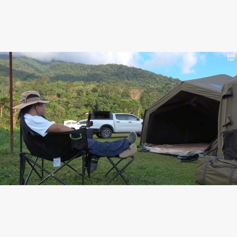 RBM Koala Hub khaki by mountains with man sitting in camp chair