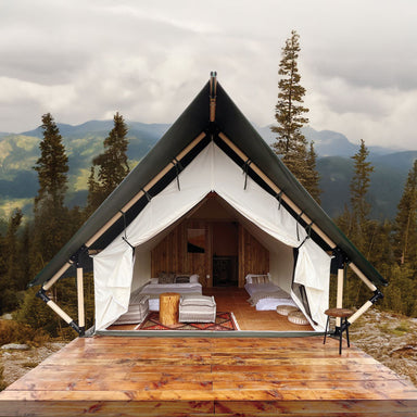 Safari Tent Aurora III by Luna Glamping in mountains with two beds and wood deck