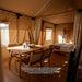 Safari Tent Eclipse by Luna Glamping interior view of dining table and bed