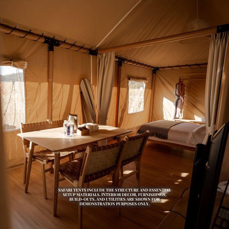 Safari Tent Eclipse by Luna Glamping interior view of dining table and bed