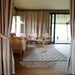 Safari Tent Eclipse by Luna Glamping interior view with couch chairs table and rug