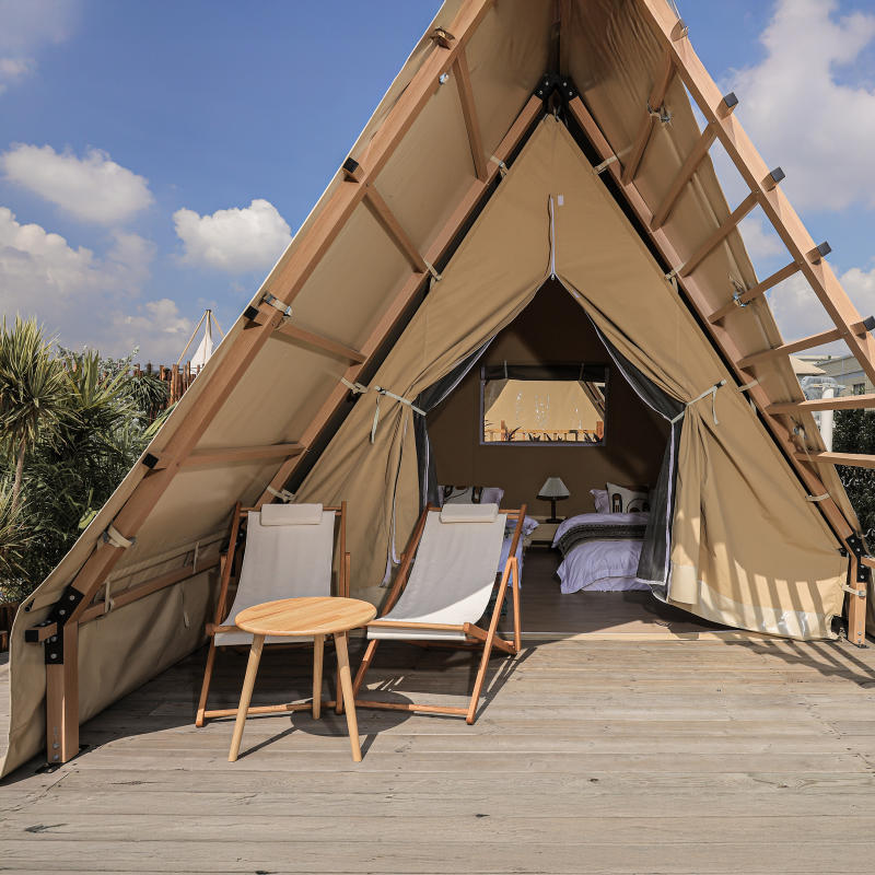 Safari Tent Equinox II by Luna Glamping close up front view with chairs on wood deck
