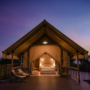 Safari Tent Solstice I by Luna Glamping front view at night