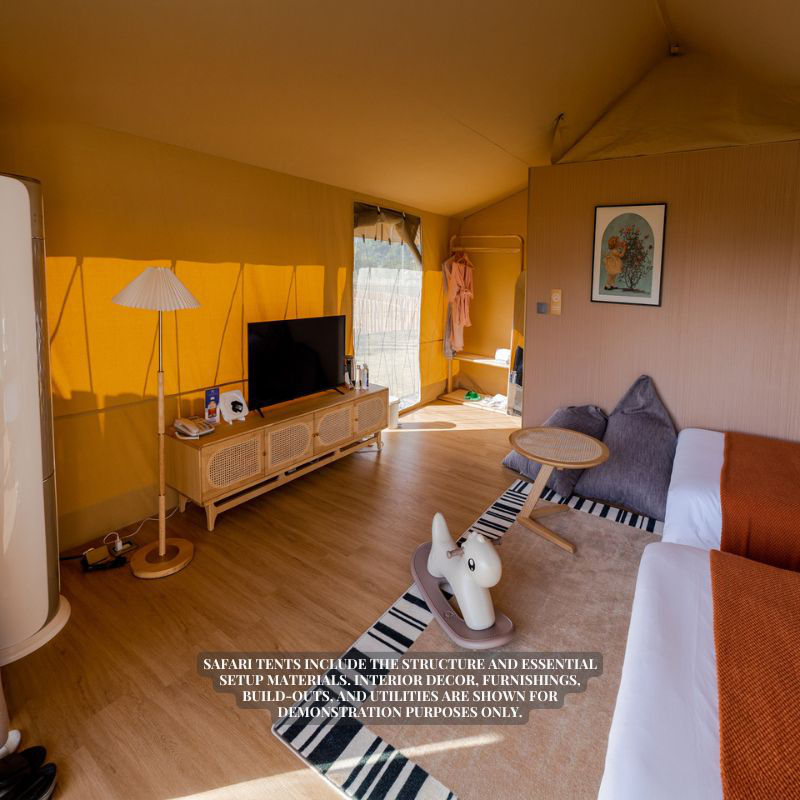 Safari Tent Zenith II by Luna Glamping interior view of bedroom with tv and two beds