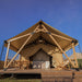 Safari Tent Zenith I by Luna Glamping front view on wood deck with dining table and lounge chairs
