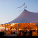 Sailcloth Event Tent by Canvas Camp Luxury Outdoor Canopy at sunset with lights