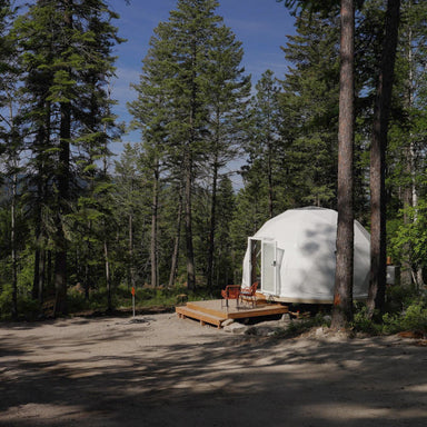 Stargazing Dome 16' Luna Glamping white in woods daytime