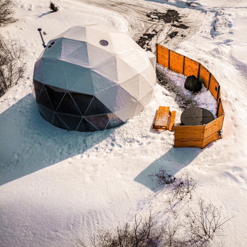 Stargazing Dome 19' Luna Glamping white drone view of dome covered in snow