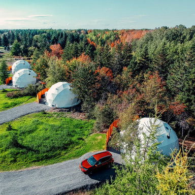 Stargazing Dome 19' Luna Glamping white drone view of four domes