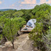 Stargazing Dome 19' Luna Glamping white front left drone view on wood deck