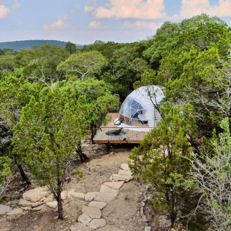 Stargazing Dome 19' Luna Glamping white front left drone view on wood deck