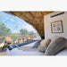 Stargazing Dome 19' Luna Glamping white interior close view of bed and front window with two chairs