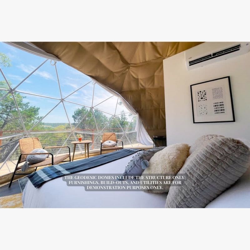 Stargazing Dome 19' Luna Glamping white interior close view of bed and front window with two chairs