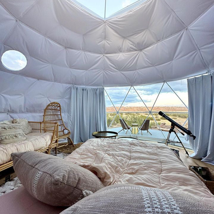 Stargazing Dome 23' Luna Glamping interior view two pink beds and telescope