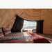 Stargazing Dome 23' Luna Glamping interior view with bed and two chair by front window