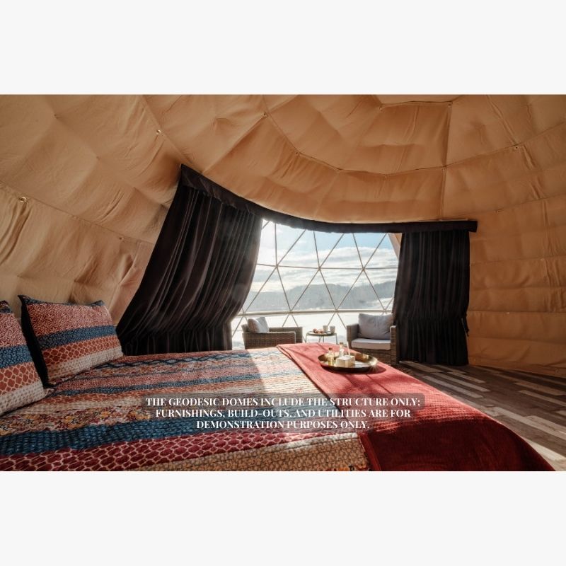 Stargazing Dome 23' Luna Glamping interior view with bed and two chair by front window