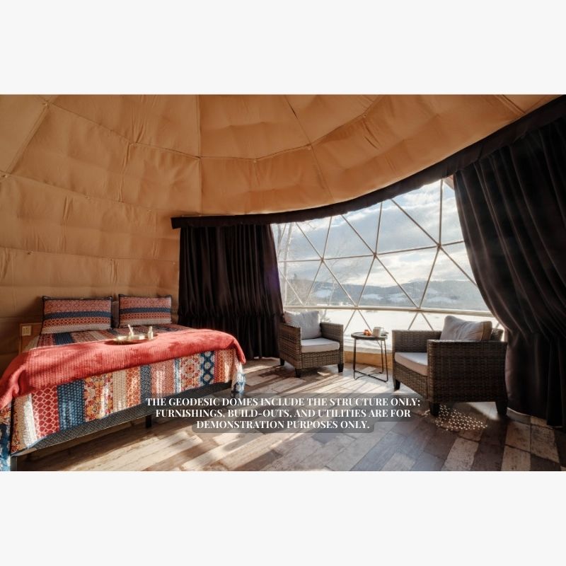 Stargazing Dome 23' Luna Glamping interior view with bed and two chairs by front window