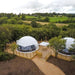 Stargazing Dome 26' Luna Glamping in white drone view on wood deck