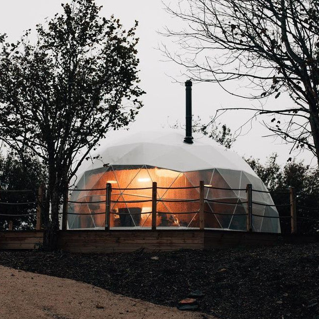 Stargazing Dome 26' Luna Glamping in white front view on wood deck