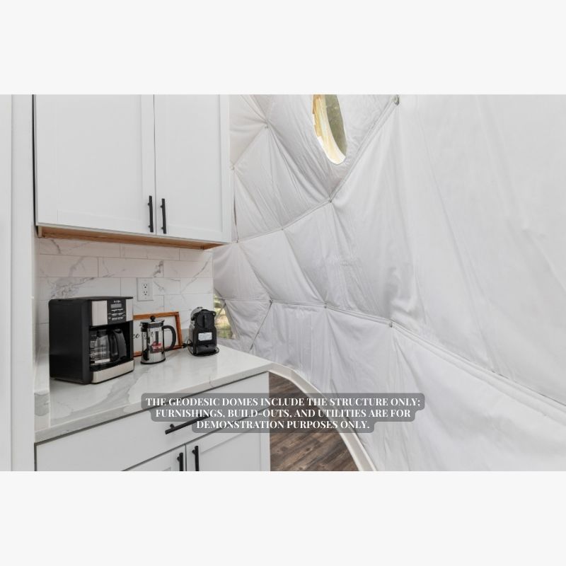 Stargazing Dome 26' Luna Glamping in white interior view of kitchen with coffee pot