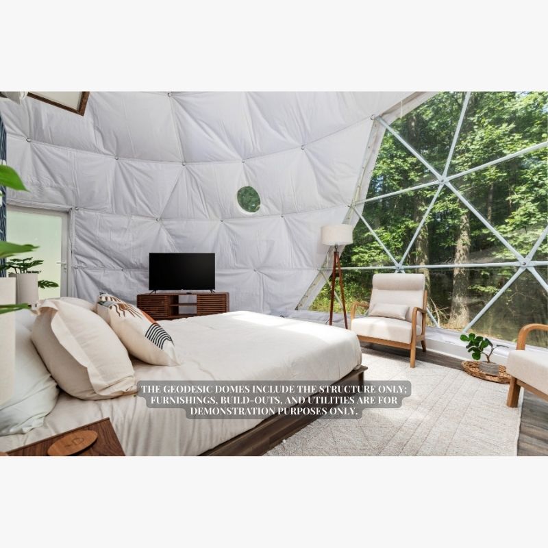 Stargazing Dome 26' Luna Glamping in white interior view with bed chair and tv