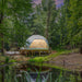 Stargazing Dome 26' Luna Glamping in white on wood deck by pond at night