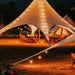 Starshade Event Tent by CanvasCamp  Luxury Outdoor Canopy at night with lights at a party
