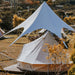 Starshade Event Tent by CanvasCamp  Luxury Outdoor Canopy behind bell tent during the day on brown grass