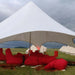 Starshade Event Tent by CanvasCamp  Luxury Outdoor Canopy close up with red bean bag chairs on grass