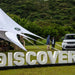 Starshade Event Tent by CanvasCamp  Luxury Outdoor Canopy land rover discovery with two men talking