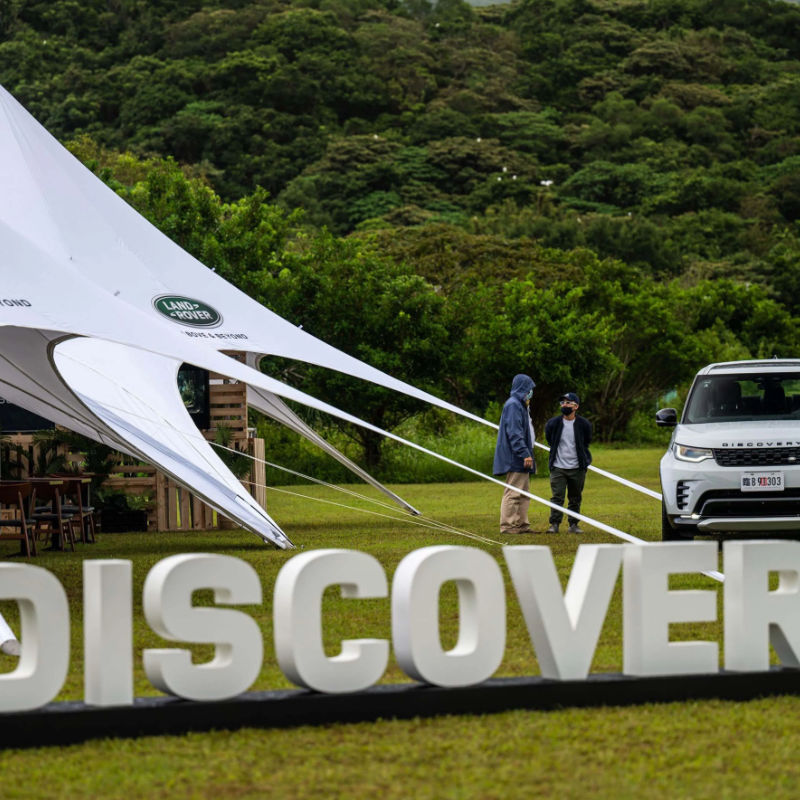 Starshade Event Tent by CanvasCamp  Luxury Outdoor Canopy land rover discovery with two men talking