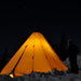 Teepee Tent Tipi 600 by Canvas Camp at night in snow with light on