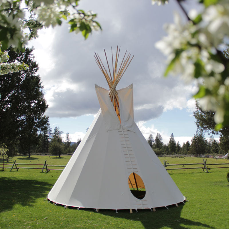 Teepee Tent by Nomadic Tipi Makers in white front view on grass
