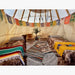 Teepee Tent by Nomadic Tipi Makers interior view two beds and two wicker chairs