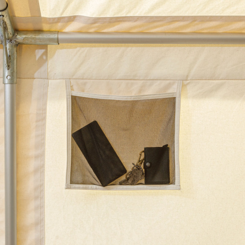 Wall Tent Canvas Camp stock photo interior view of storage pockets