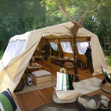 Wall Tent Mess Tent III by Canvas Camp front view with furniture and deck