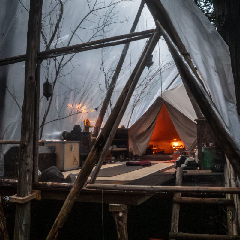 Yurt Tent Sibley Pro 400 by Canvas Camp in woods on wood deck