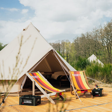 Yurt Tent Sibley Pro 400 by Canvas Camp on wood deck with two lounge chairs